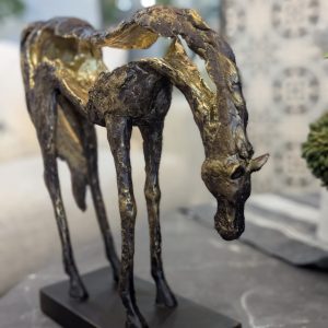 meadow grazing horse sculpture